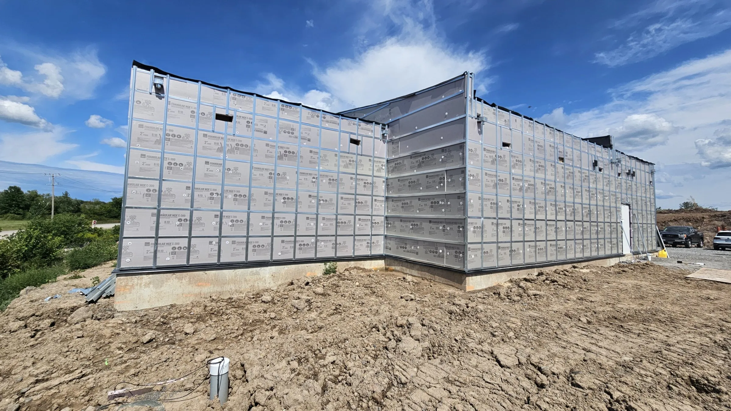 Building corner with insulation and steel girts before cladding