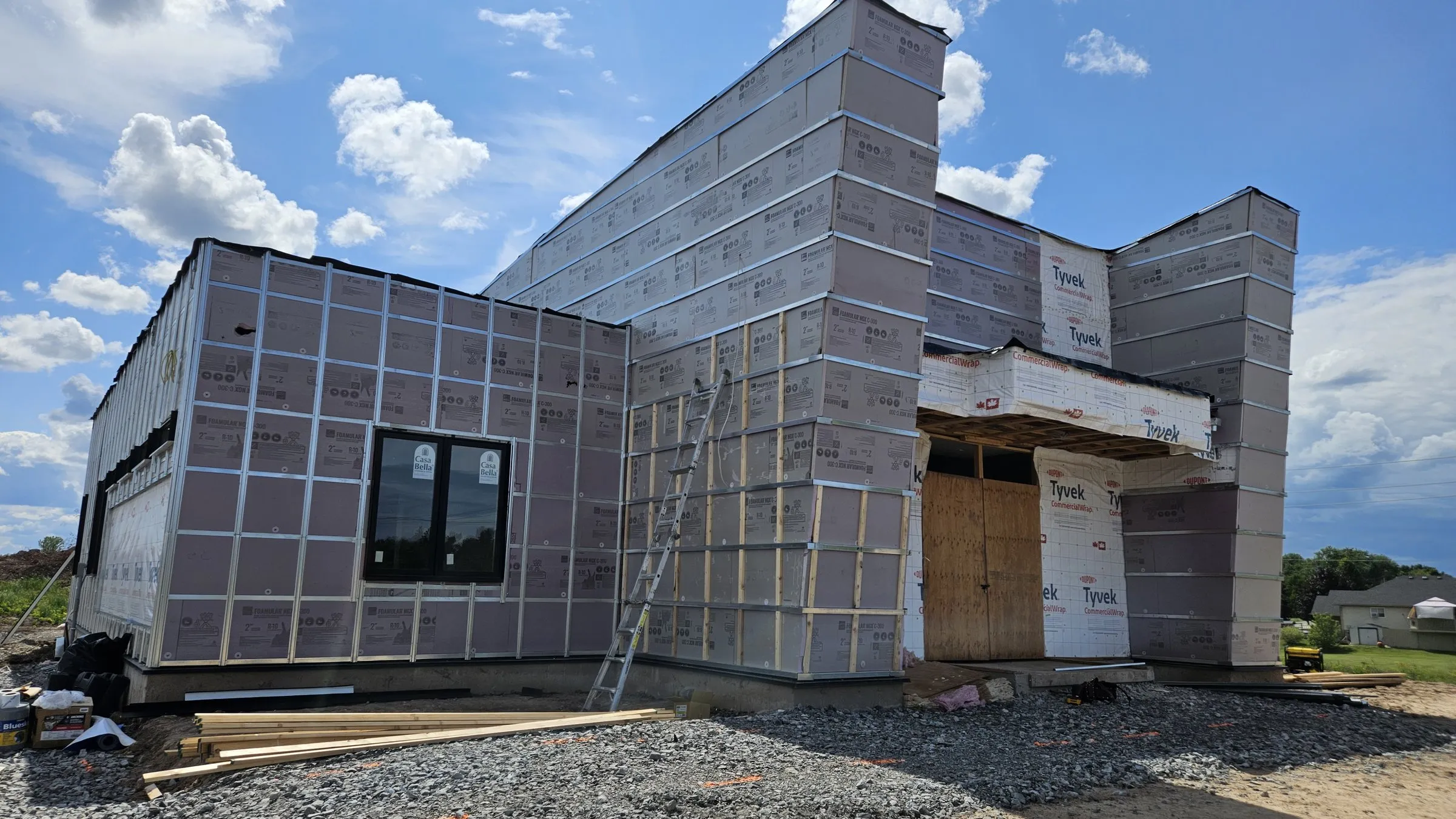 Entrance elevation with girts, insulation and house wrap