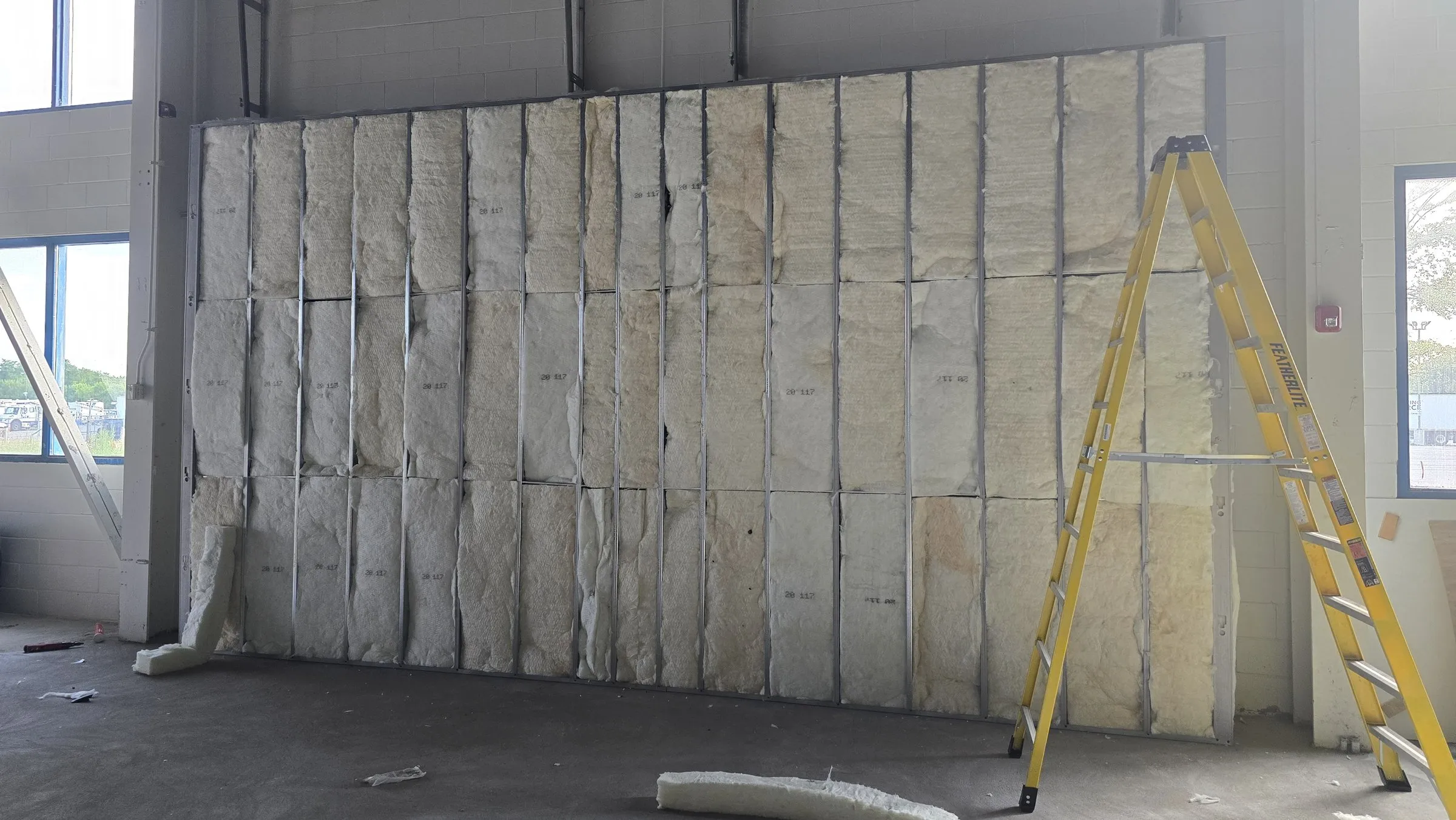 Batt insulation installed between the steel studs