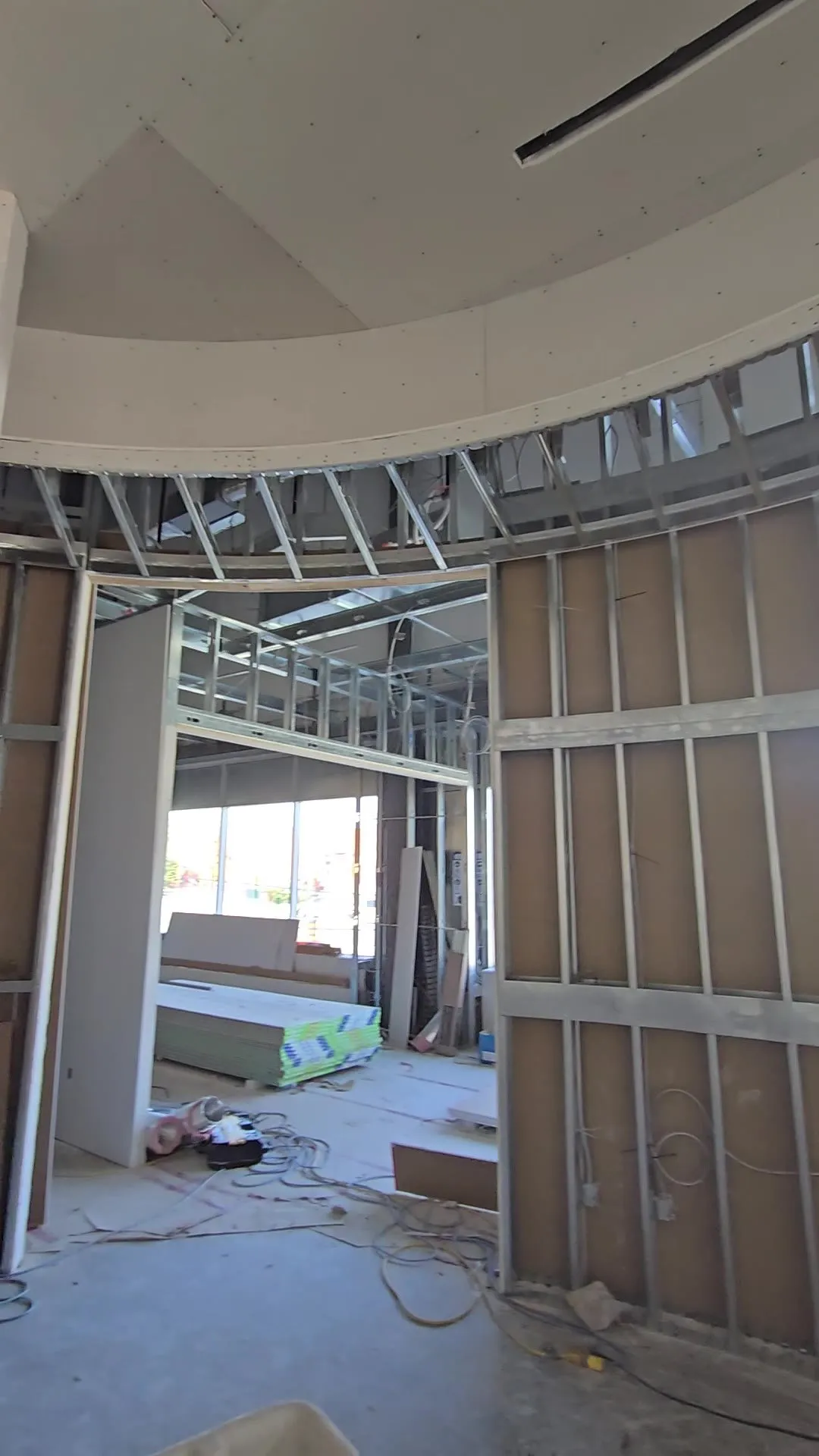 Video of curved steel stud walls and a curved bulkhead, with drywall started on the radius
